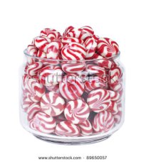 stock-photo-glass-jar-full-of-red-striped-caramel-sweets-isolated-on-white-background-89650057